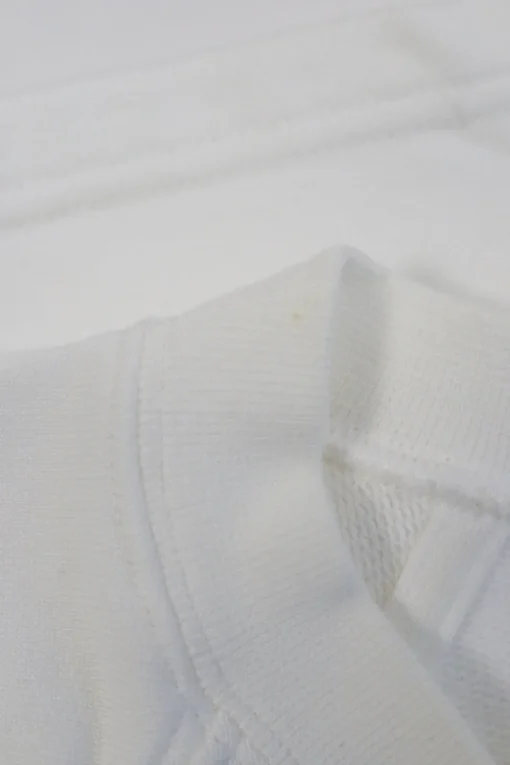 White cotton jersey raglan sleeve cropped slogan t-shirt featuring foiled Coco Mark laurel wreath motif