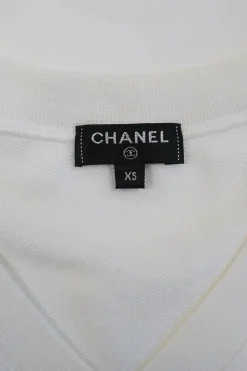 White cotton jersey raglan sleeve cropped slogan t-shirt featuring foiled Coco Mark laurel wreath motif