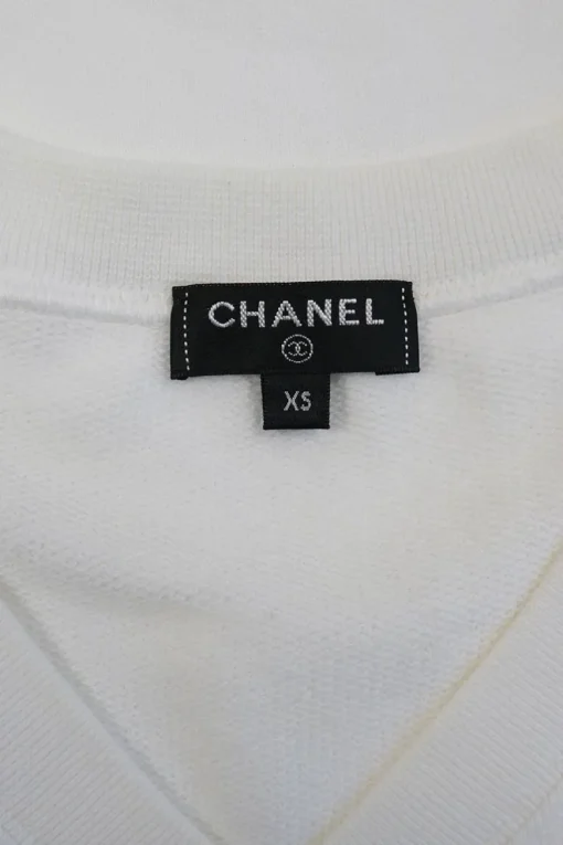 White cotton jersey raglan sleeve cropped slogan t-shirt featuring foiled Coco Mark laurel wreath motif