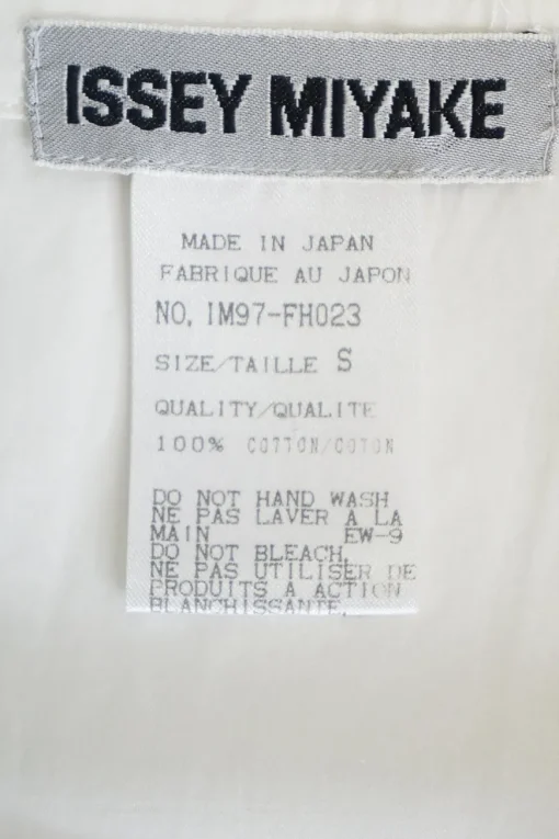 White cotton poplin apron-style sleeveless asymmetric mini shift dress