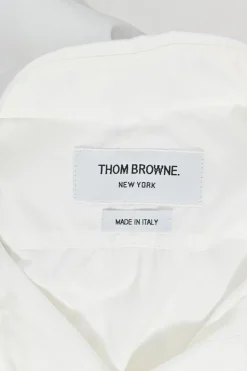 White cotton poplin bow tie collar button-front shirt with curved hem