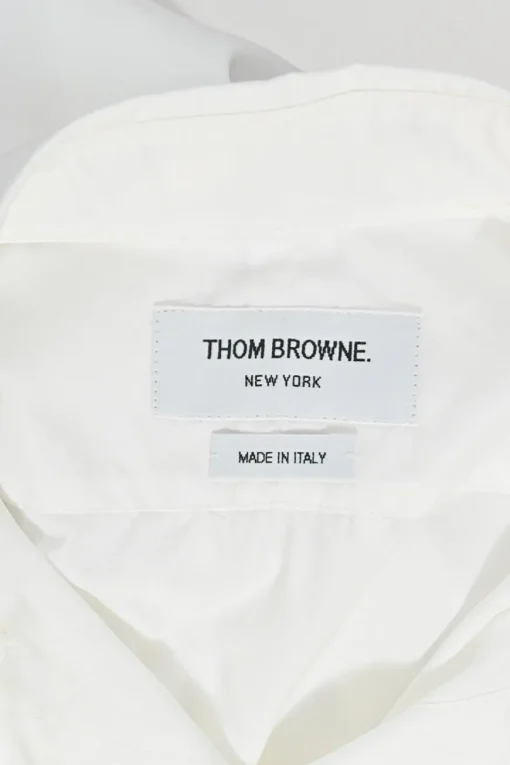 White cotton poplin bow tie collar button-front shirt with curved hem