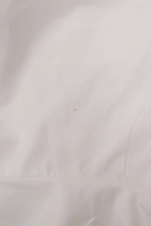 White cotton poplin foldover cold-shoulder button-front shirt