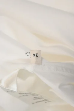 White cotton poplin frill-trimmed high-collar button-front shirt