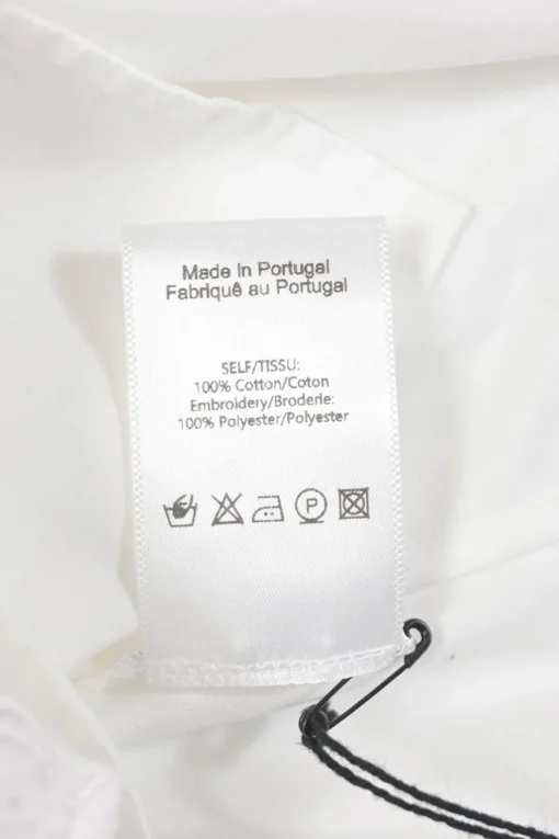 White cotton poplin point collar button-front shirt featuring tonal scalloped broderie trim inserts