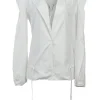 White cotton poplin single breasted notch lapel plunge neck blouse with flutter sleeve appliqué