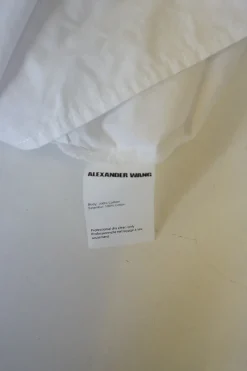 White cotton poplin sleeveless pleated shirt