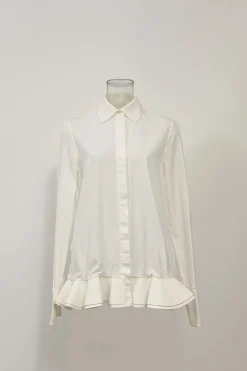 White cotton poplin spread collar button-front swing-style shirt with ruffled hem