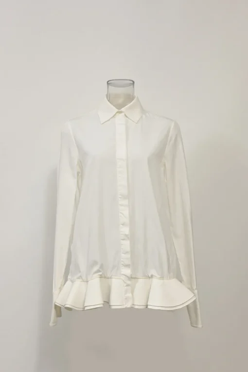 White cotton poplin spread collar button-front swing-style shirt with ruffled hem