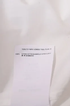 White cotton poplin spread collar button-front shirt