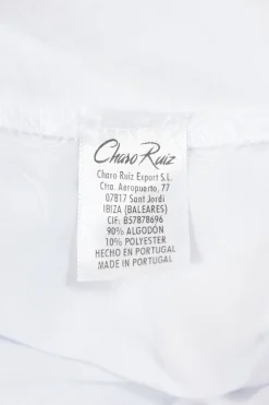 White cotton-blend peek-a-boo puff-sleeve mini bustier dress with Rouleaux trim appliqué