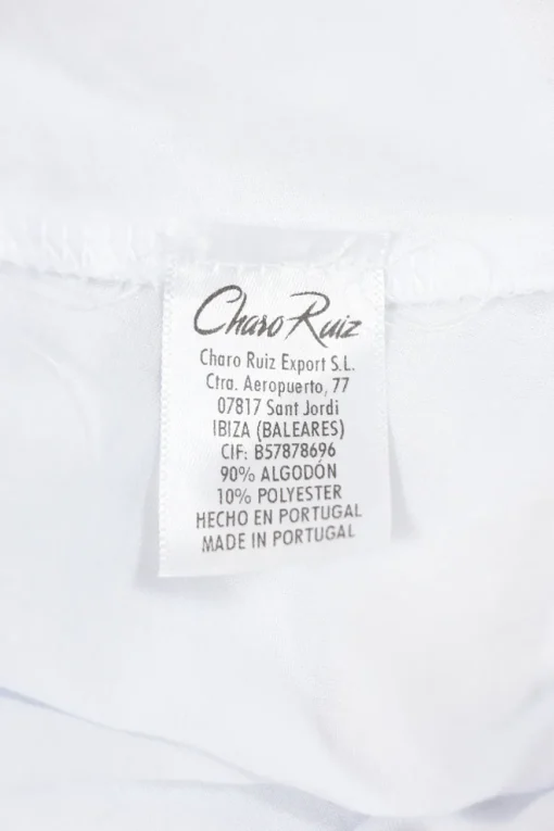 White cotton-blend peek-a-boo puff-sleeve mini bustier dress with Rouleaux trim appliqué