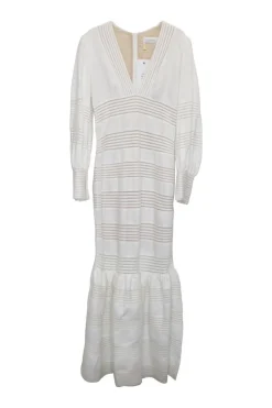 White crochet-trimmed linen plunge neck maxi dress with bishop sleeves and flounce hem