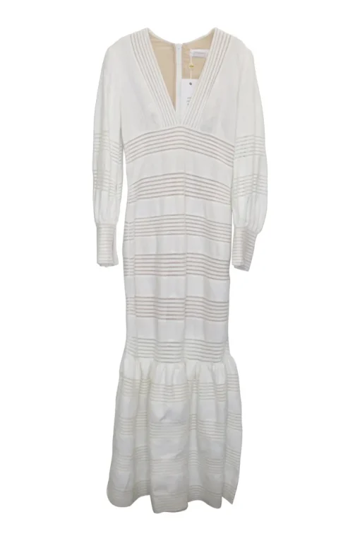 White crochet-trimmed linen plunge neck maxi dress with bishop sleeves and flounce hem