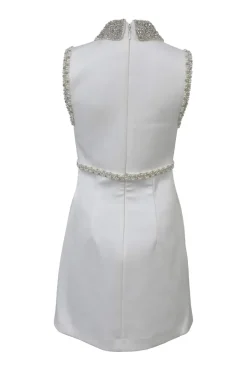 White embellished polyester Delaney sleeveless bridal mini dress featuring bead broderie motif along collar, bodice, and darted waist