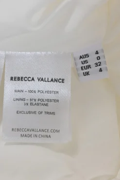 White embellished polyester Delaney sleeveless bridal mini dress featuring bead broderie motif along collar, bodice, and darted waist