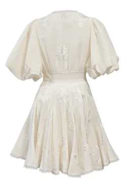 White floral-embroidered cotton-blend balloon sleeve plunge neck mini dress with button-loop empire waist and godet skirt inserts