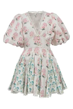 White floral-embroidered plunge neck mini skater dress featuring balloon sleeves and godet skirt inserts