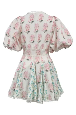 White floral-embroidered plunge neck mini skater dress featuring balloon sleeves and godet skirt inserts