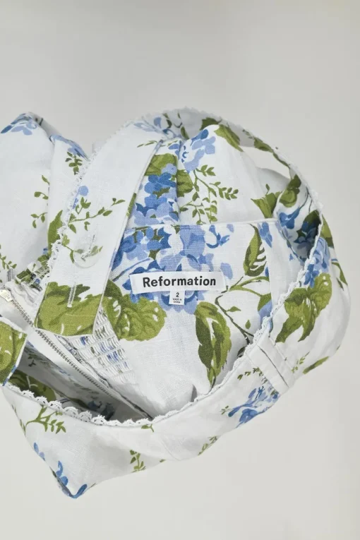 White lace-trimmed linen Riviera floral print Tagliatelle sun dress with hook and eye-fastened fitted bodice