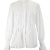 White long-sleeved top with pleated hem