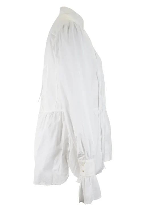White long-sleeved top with pleated hem