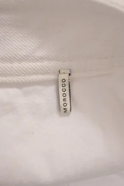 White low-rise Caly zip-up mini skirt with extended tab closure and exposed zip slanted pockets