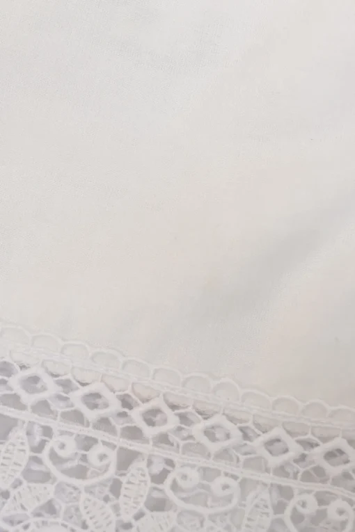 White off-shoulder tier-ruffle puff sleeve micro-mini mini dress featuring tonal crochet lace inserts