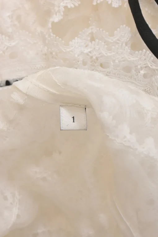 White paneled lace short-sleeve tiered top