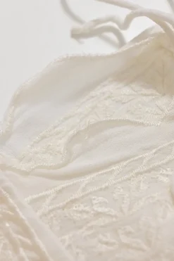 White paneled viscose flutter sleeve bateau neck blouse with scalloped edges