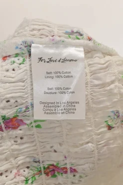 White shirred rose cotton broderie Anglaise puff-sleeve ruffle crop-top