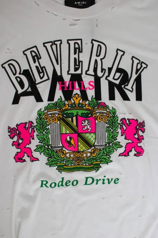 White short-sleeved "beverly hills" multi print tee adorned with holes