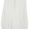 White silk chiffon polka dot print pullover tie-front tunic top with gathered neckline and blouson sleeves