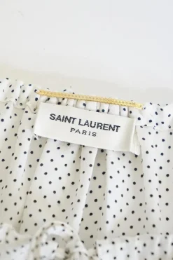White silk chiffon polka dot print pullover tie-front tunic top with gathered neckline and blouson sleeves
