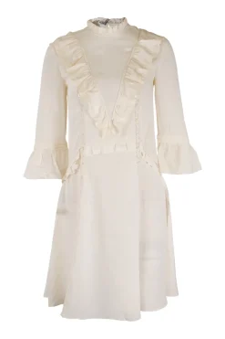White silk mock neckline mini dress with lace-trimmed fitted bodice and three-quarter length flounce sleeves