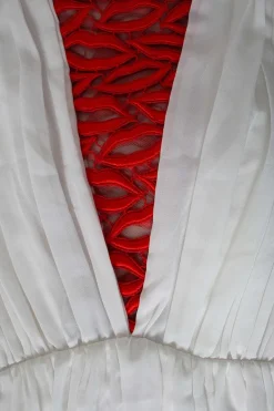 White sleeveless maxi dress with red accent