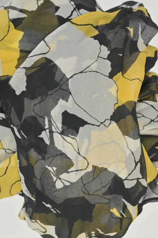 Yellow and black semi-sheer silk floral print long sleeve wrap A-line dress with tie-cuff sleeves