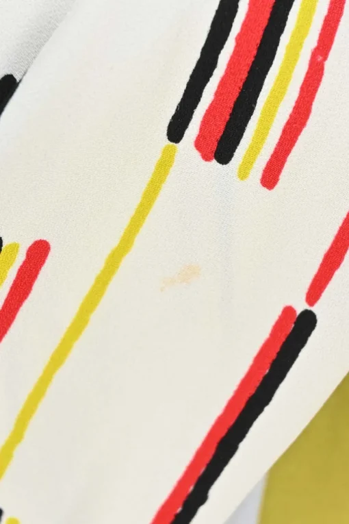 Yellow and chartreuse viscose graphic abstract print mock neck A-line mini dress with contrast piping