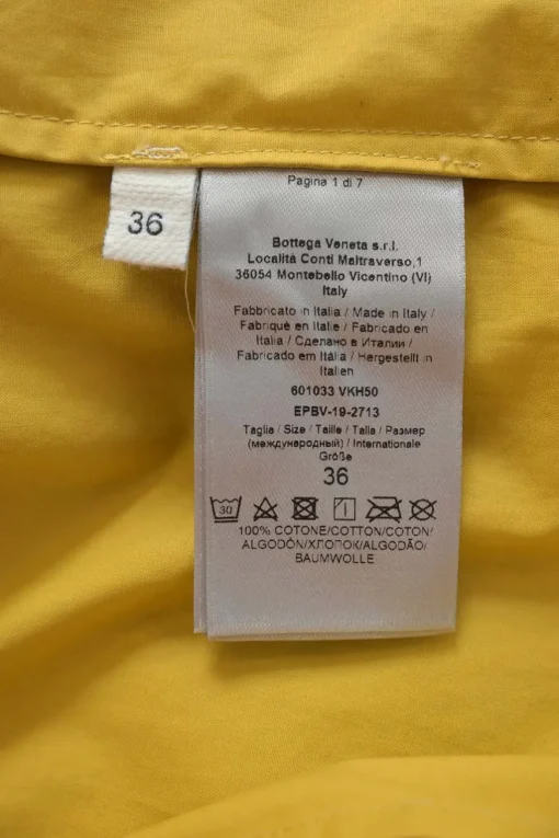 Yellow cotton stand collar dolman sleeve button-front shirt dress with oversized bellows pocket shoulders