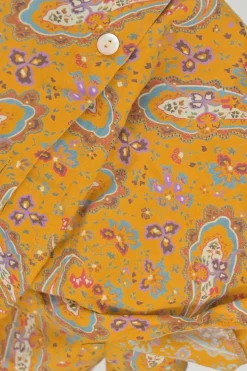 Yellow cotton voile paisley print button-front collarless long sleeve blouse