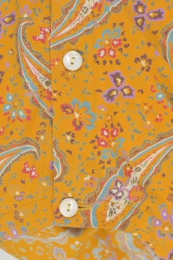 Yellow cotton voile paisley print button-front collarless long sleeve blouse