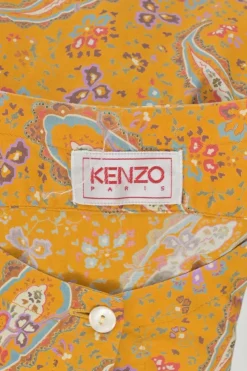 Yellow cotton voile paisley print button-front collarless long sleeve blouse