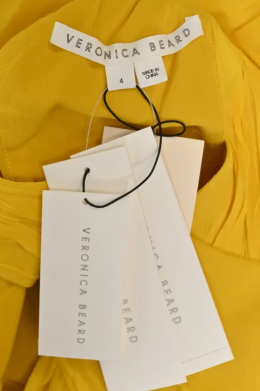 Yellow draped silk wrap bodice tiered gown with keyhole back