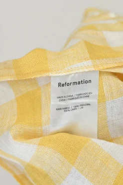 Yellow linen gingham puff sleeve sun dress with cutout at centre front