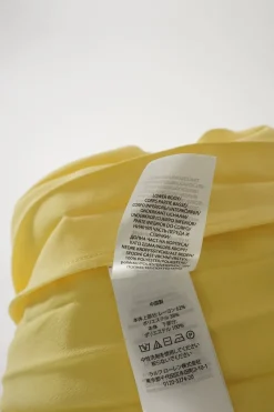 Yellow polyester mixed media pullover lace-up cap sleeve midi dress with plissé A-line skirt