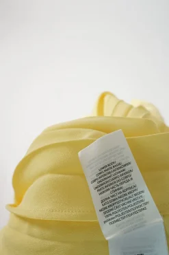 Yellow polyester mixed media pullover lace-up cap sleeve midi dress with plissé A-line skirt