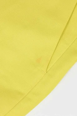 Yellow polyester-blend belted mini skirt featuring darted slant pockets