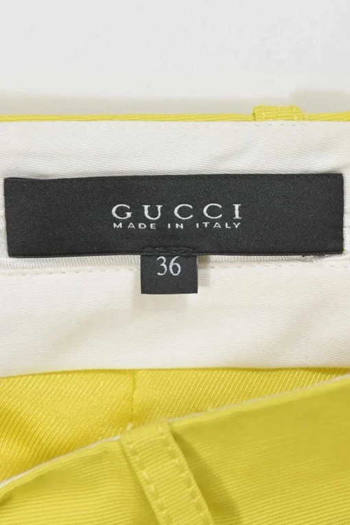 Yellow polyester-blend belted mini skirt featuring darted slant pockets